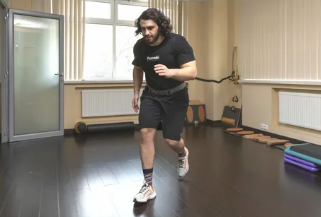 Rehabilitation client practicing supervised balance and strengthening work
